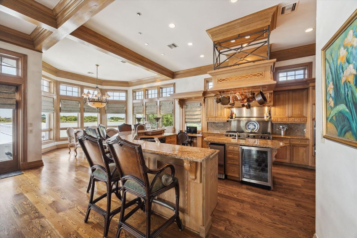 Chandelier, Dining room, Interior, Kitchen, Pendant Lights, Recessed Lighting, Stainless Steel Appliances, Wooden Beams, Wood Texture Flooring