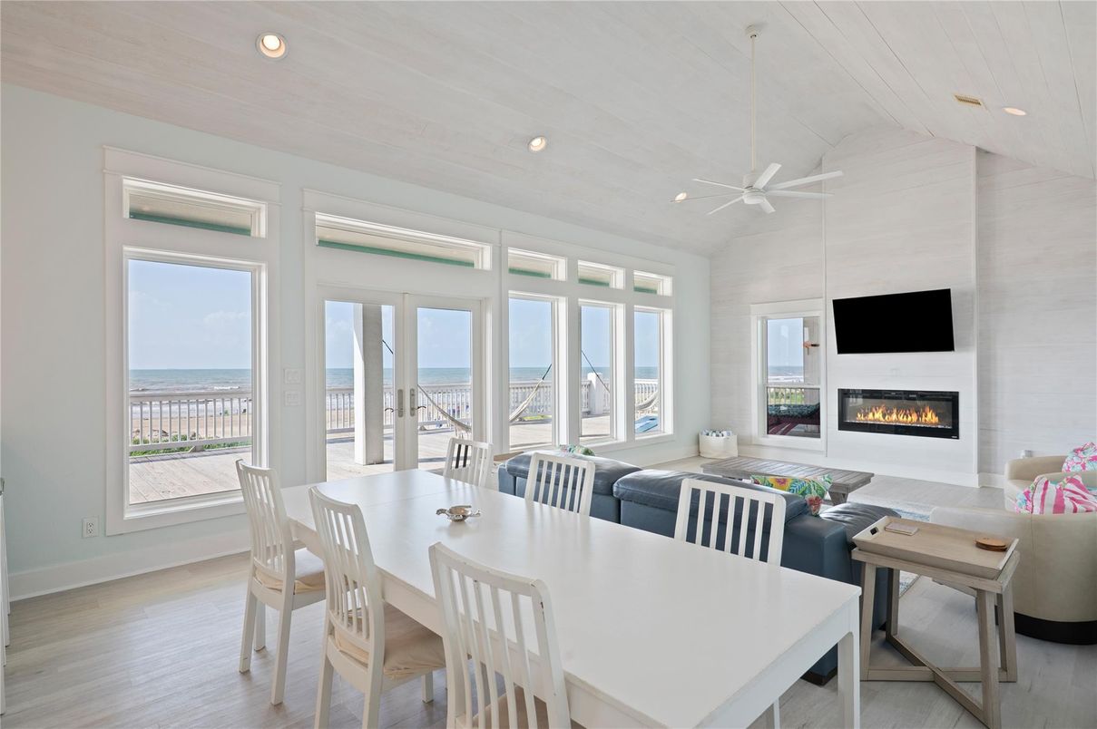 Dining room, Fireplace, Interior, Living room, Recessed Lighting, Water, Wood Texture Flooring