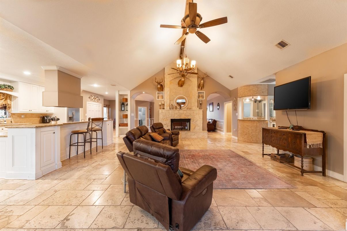 Chandelier, Fireplace, Interior, Kitchen, Living room, Recessed Lighting, Stone Walls