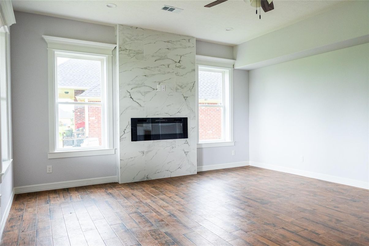 Empty room, Fireplace, Interior, Marble Walls, Recessed Lighting, Wood Texture Flooring
