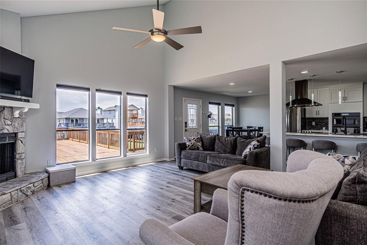 Dining room, Fireplace, Interior, Kitchen, Living room, Recessed Lighting, Wood Texture Flooring