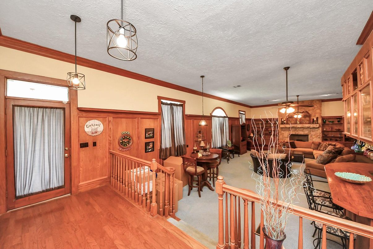 Dining room, Fireplace, Interior, Living room, Pendant Lights, Recessed Lighting, Stone Walls, Wood Texture Flooring