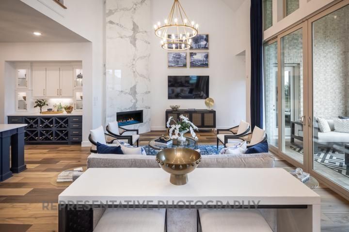 Chandelier, Dining room, Fireplace, Interior, Living room, Marble Walls, Pendant Lights, Recessed Lighting, Wood Texture Flooring