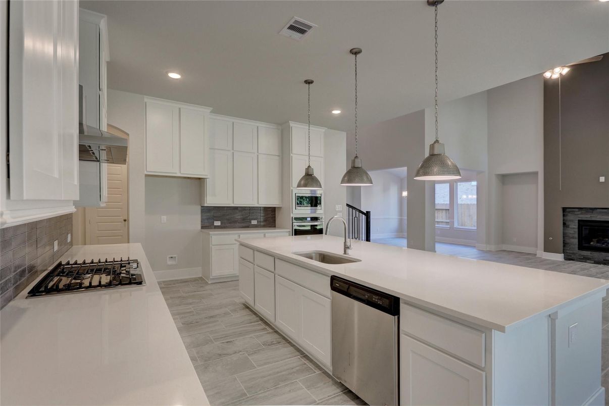 Fireplace, Interior, Kitchen, Pendant Lights, Recessed Lighting, Stainless Steel Appliances, Wood Texture Flooring