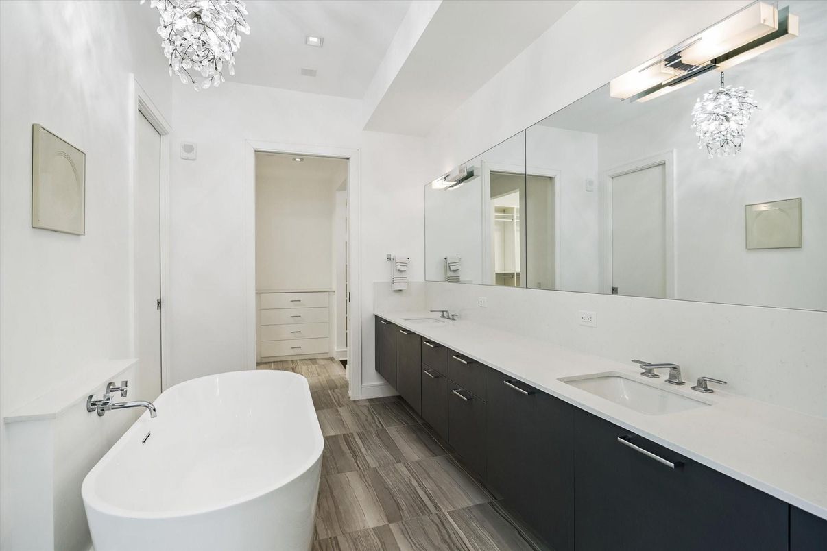 Bathroom, Dual Sink Vanities, Free Standing Baths, Interior, Pendant Lights, Recessed Lighting, Walk-in Closets, Wood Texture Flooring