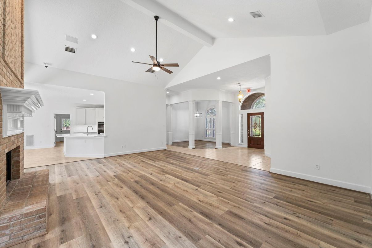 Empty room, Fireplace, Interior, Kitchen, Pendant Lights, Recessed Lighting, Wood Texture Flooring