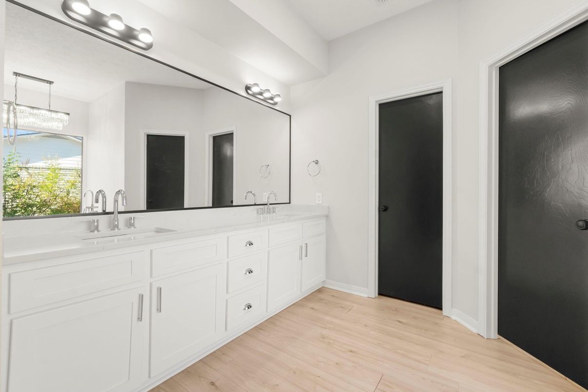 Bathroom, Chandelier, Dual Sink Vanities, Interior, Wood Texture Flooring