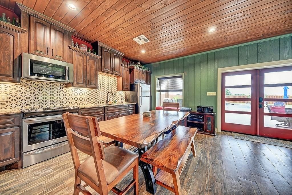 Dining room, Interior, Kitchen, Recessed Lighting, Stainless Steel Appliances, Wooden Ceilings, Wood Texture Flooring