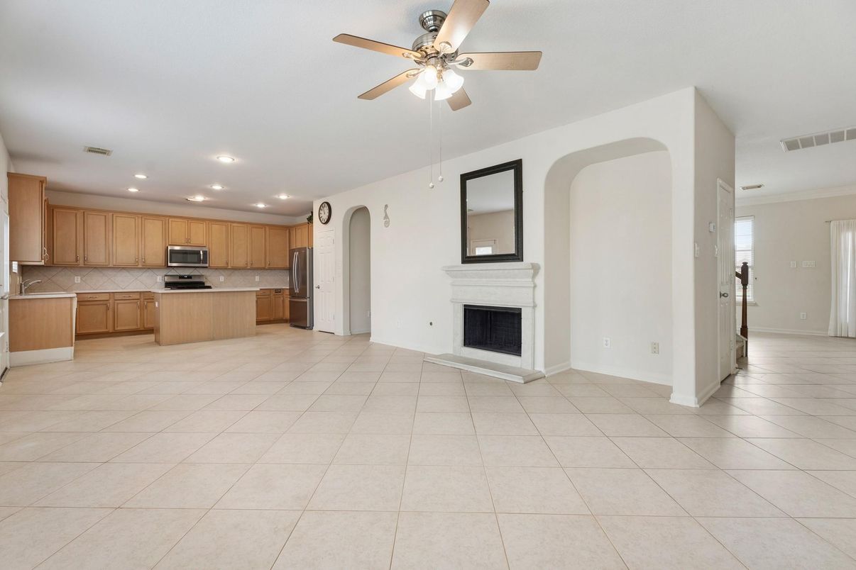 Empty room, Fireplace, Interior, Kitchen, Recessed Lighting, Stainless Steel Appliances