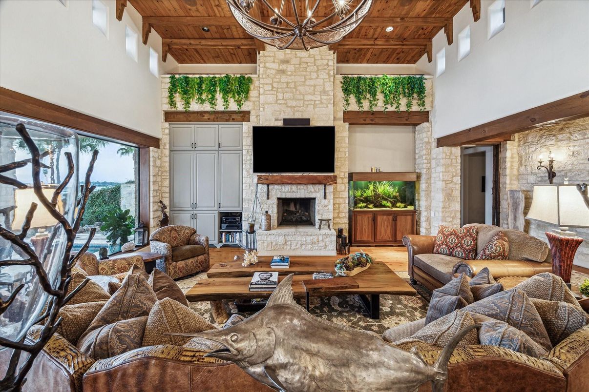 Chandelier, Fireplace, Interior, Living room, Recessed Lighting, Stone Walls, Wooden Beams, Wooden Ceilings, Wood Texture Flooring