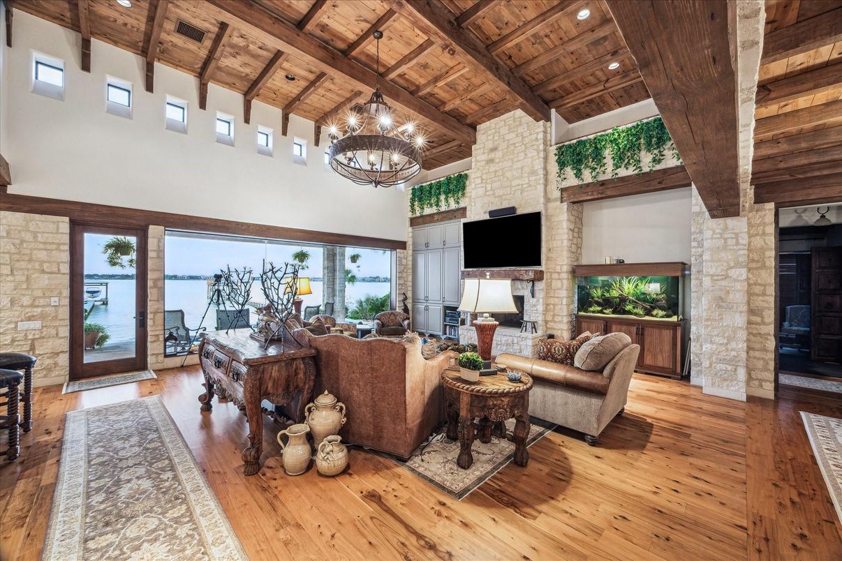 Chandelier, Fireplace, Interior, Living room, Recessed Lighting, Stone Walls, Wooden Beams, Wooden Ceilings, Wood Texture Flooring