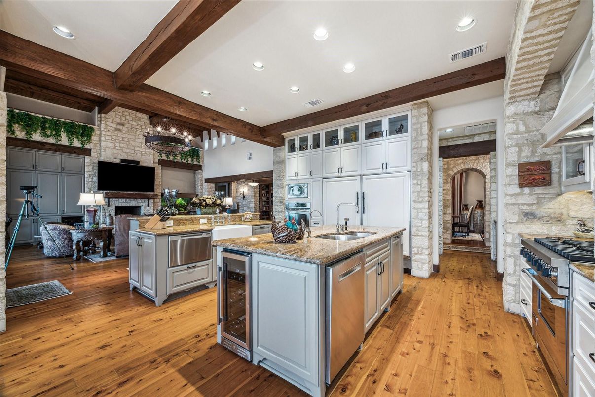 Fireplace, Interior, Kitchen, Living room, Recessed Lighting, Stainless Steel Appliances, Stone Walls, Wooden Beams, Wood Texture Flooring