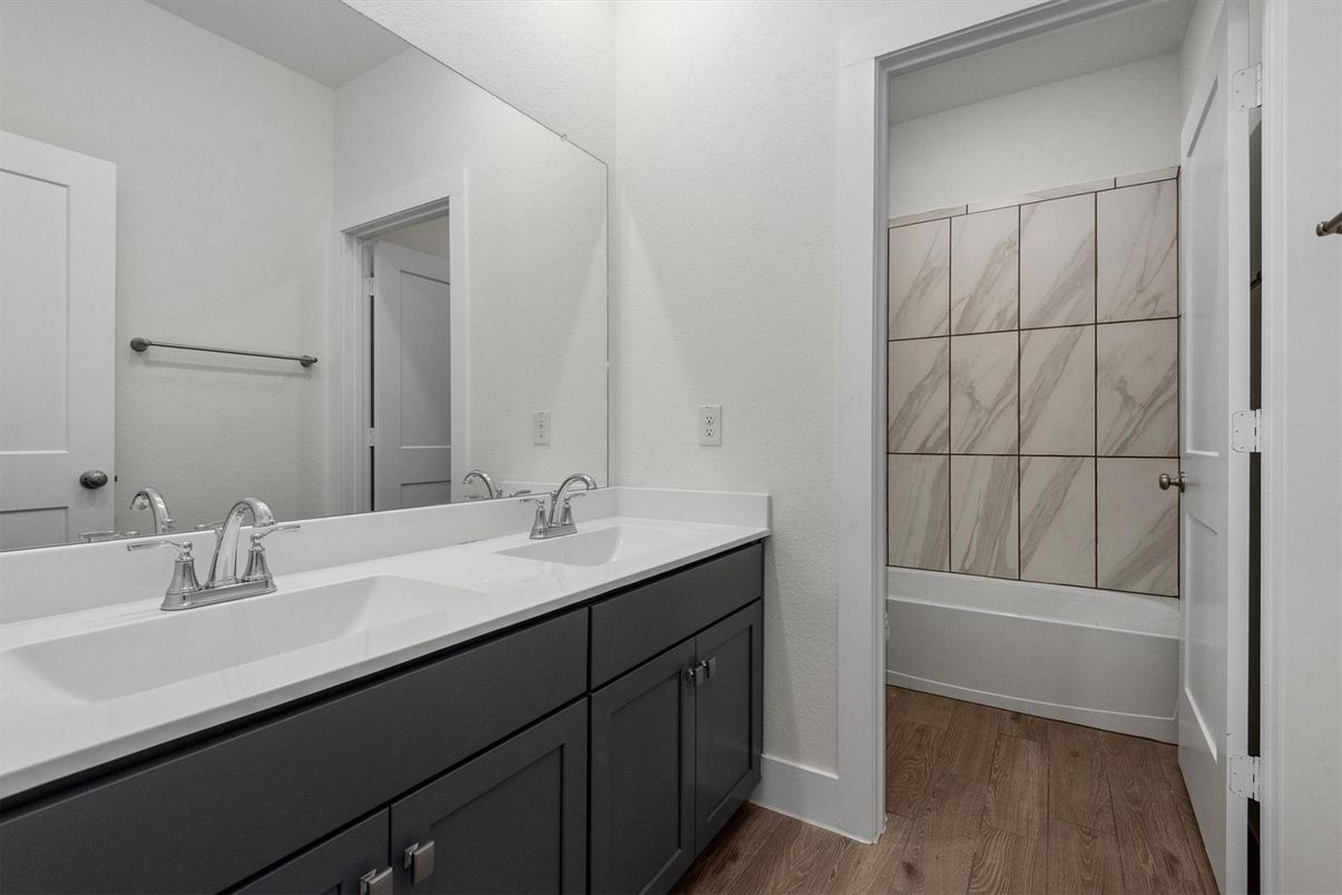 Bathroom, Dual Sink Vanities, Interior, Marble Walls, Wood Texture Flooring
