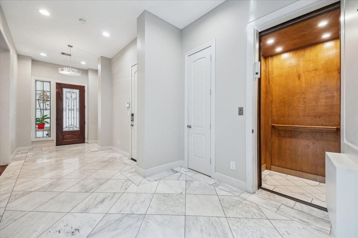 Elevator, Interior, Marble, Pendant Lights, Recessed Lighting, Wooden Walls