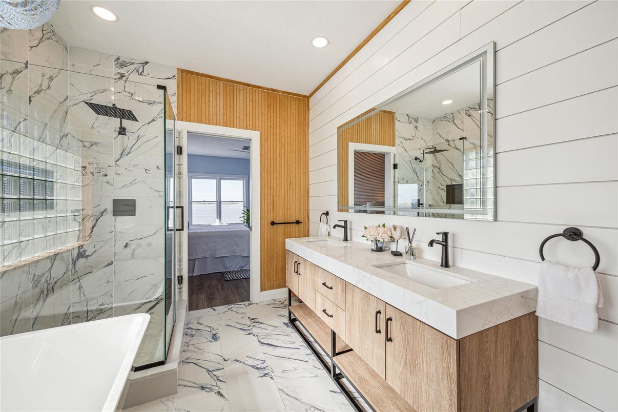 Bathroom, Dual Sink Vanities, Free Standing Baths, Glass Shower, Interior, Marble, Marble Walls, Recessed Lighting