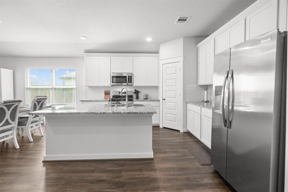 Dining room, Interior, Kitchen, Recessed Lighting, Stainless Steel Appliances, Wood Texture Flooring