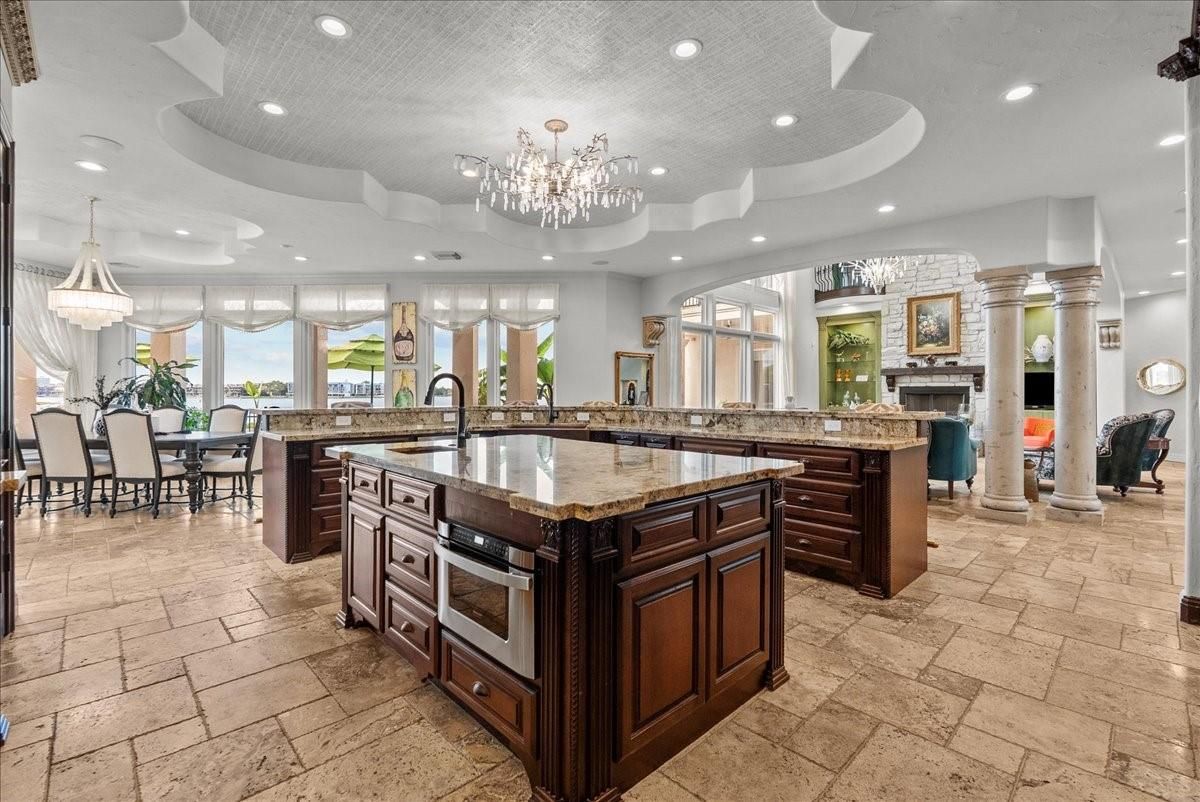 Chandelier, Dining room, Fireplace, Interior, Kitchen, Recessed Lighting, Stainless Steel Appliances