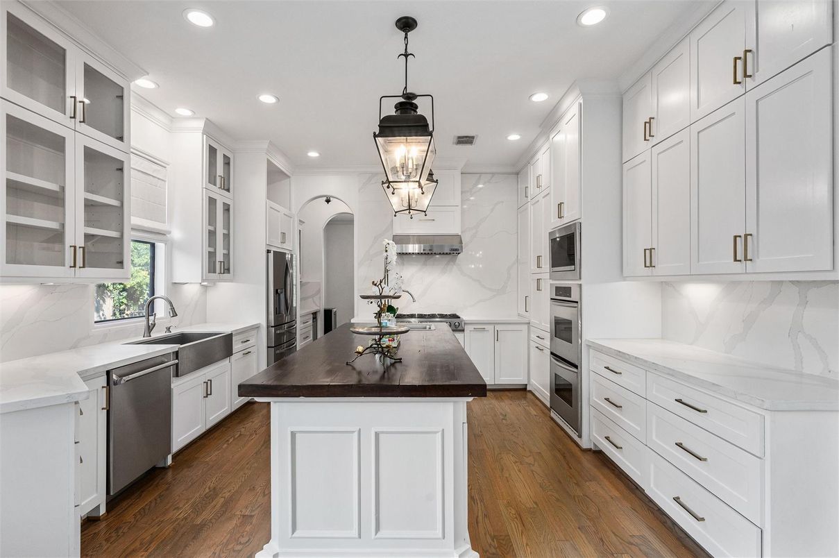 Interior, Kitchen, Marble Walls, Pendant Lights, Recessed Lighting, Stainless Steel Appliances, Wood Texture Flooring