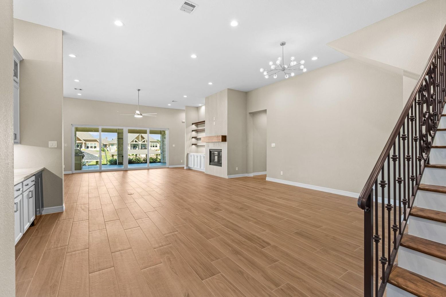 Empty room, Fireplace, Interior, Pendant Lights, Recessed Lighting, Wood Texture Flooring