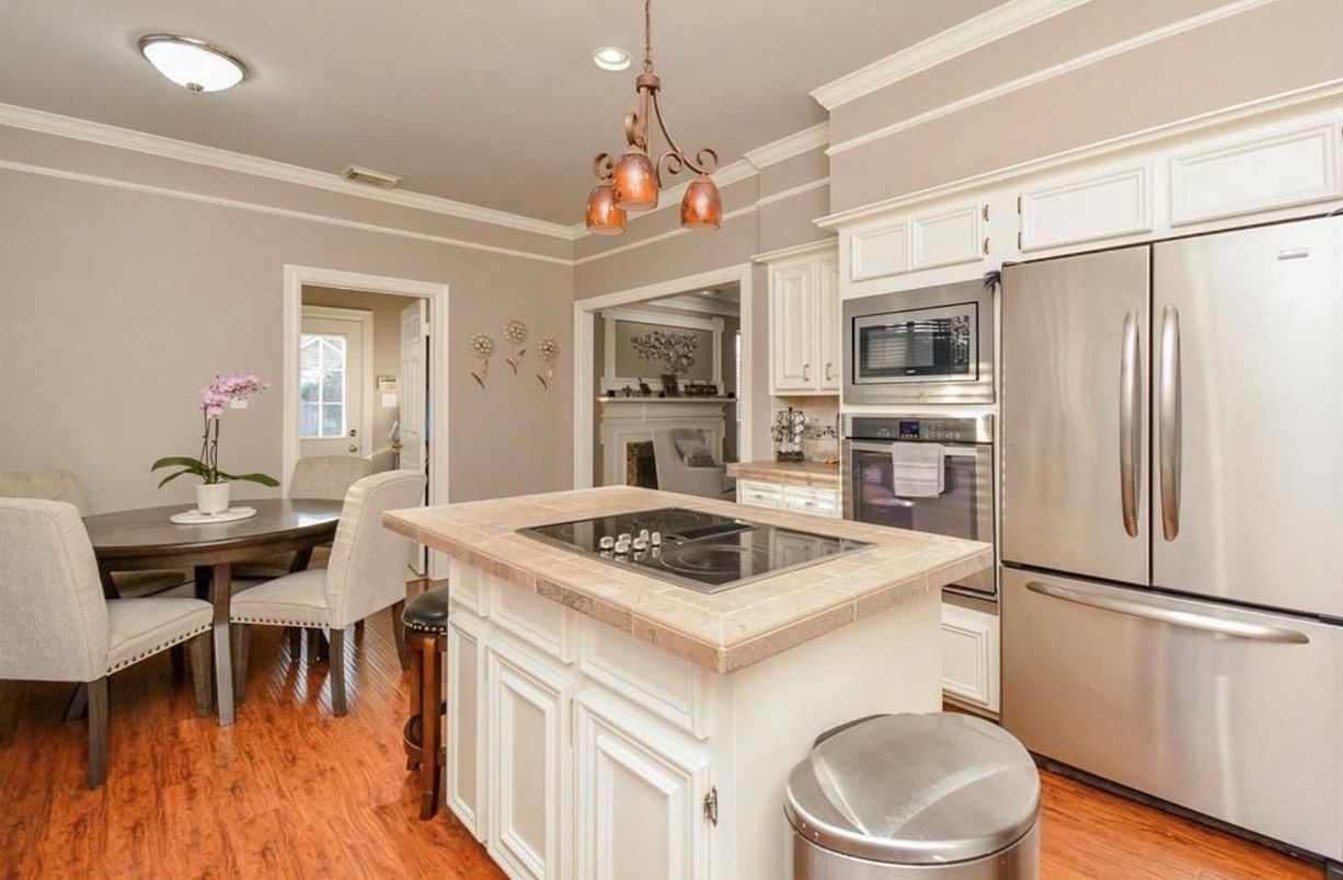 Dining room, Interior, Kitchen, Recessed Lighting, Stainless Steel Appliances, Tile Countertops, Wood Texture Flooring