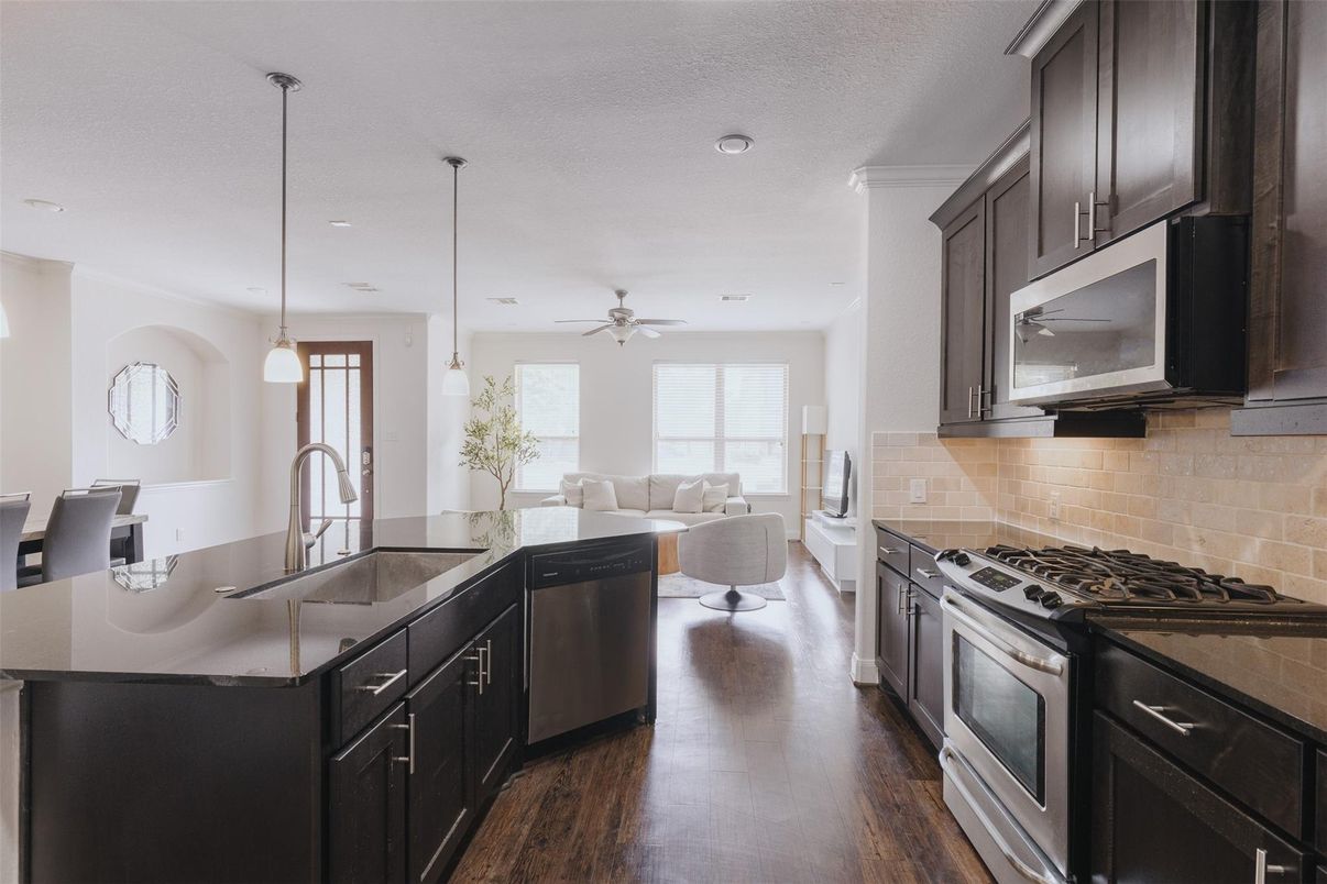 Dining room, Interior, Kitchen, Living room, Pendant Lights, Recessed Lighting, Stainless Steel Appliances, Wood Texture Flooring