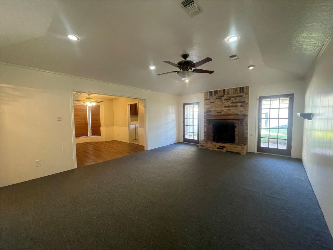 Empty room, Fireplace, Interior, Recessed Lighting, Stone Walls, Wood Texture Flooring