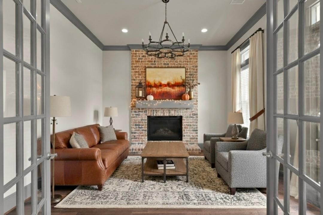 Chandelier, Fireplace, Interior, Living room, Recessed Lighting, Stone Walls, Wood Texture Flooring