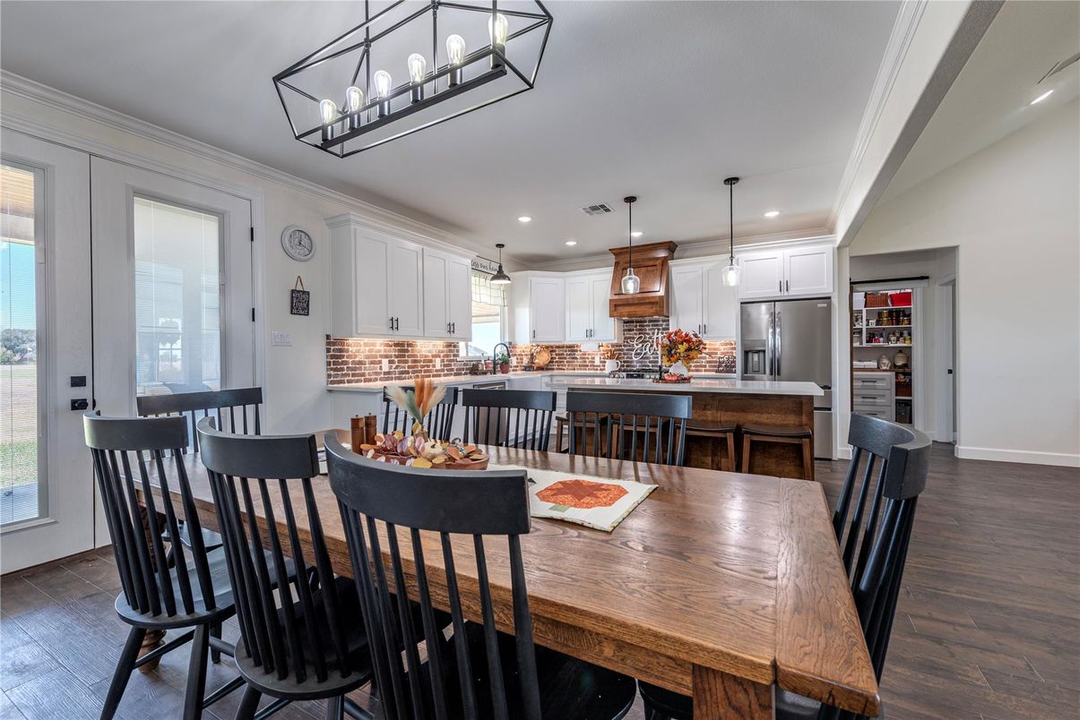Dining room, Interior, Kitchen, Pendant Lights, Recessed Lighting, Stainless Steel Appliances, Wood Texture Flooring