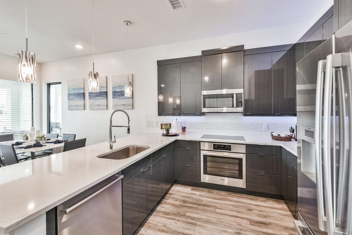 Dining room, Interior, Kitchen, Pendant Lights, Recessed Lighting, Stainless Steel Appliances, Wood Texture Flooring