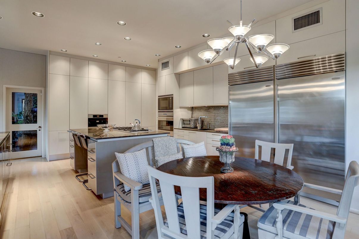 Dining room, Interior, Kitchen, Pendant Lights, Recessed Lighting, Stainless Steel Appliances, Wood Texture Flooring