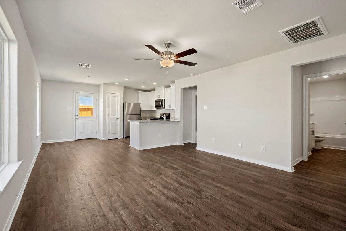 Empty room, Interior, Kitchen, Recessed Lighting, Stainless Steel Appliances, Wood Texture Flooring
