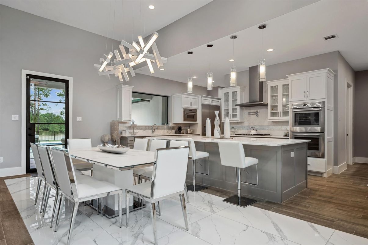 Dining room, Interior, Kitchen, Marble, Pendant Lights, Recessed Lighting, Stainless Steel Appliances, Wood Texture Flooring
