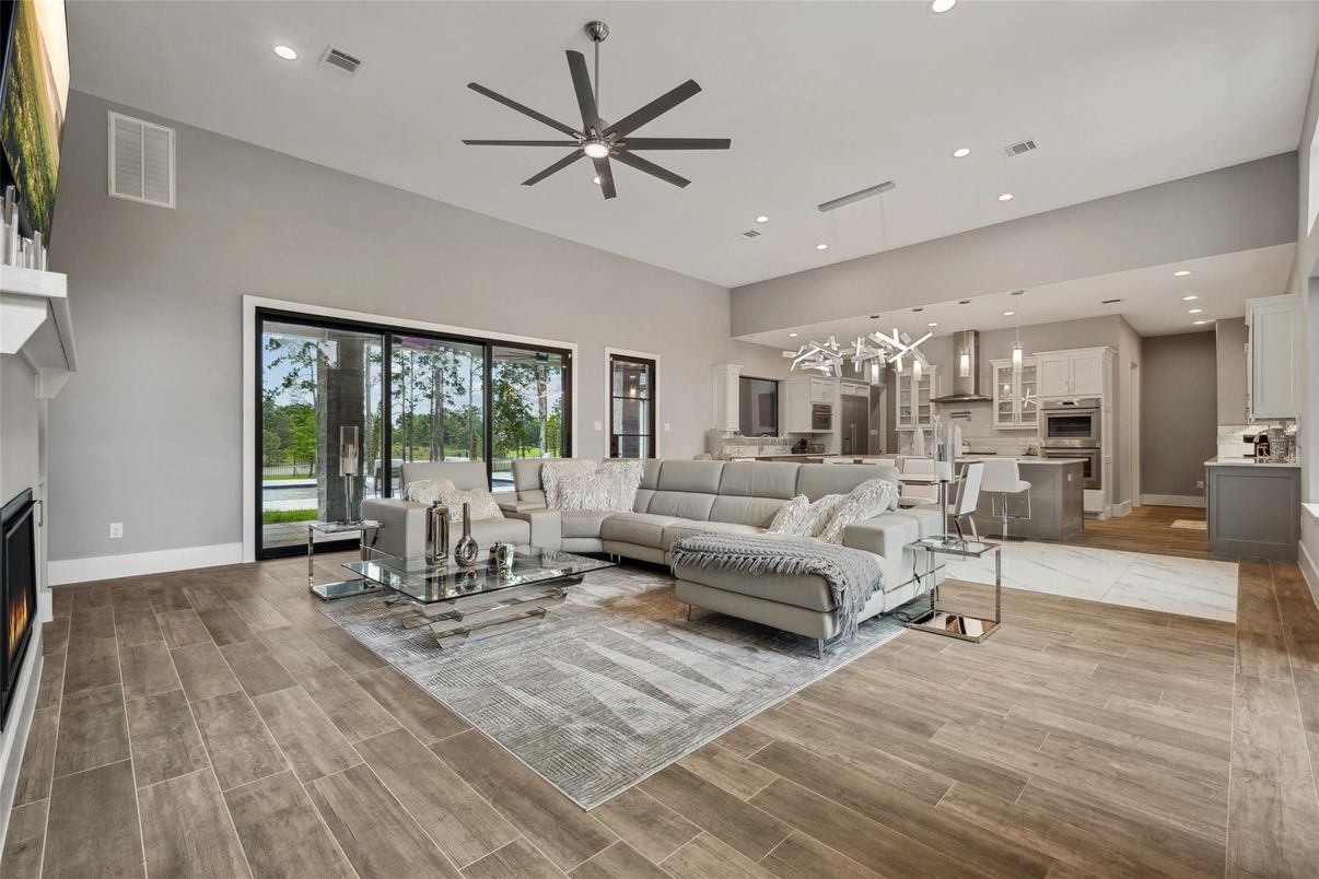 Fireplace, Interior, Kitchen, Living room, Pendant Lights, Recessed Lighting, Stainless Steel Appliances, Wood Texture Flooring