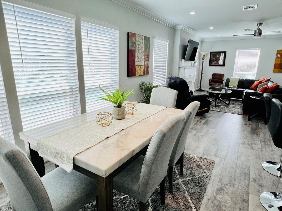 Dining room, Fireplace, Interior, Living room, Recessed Lighting, Wood Texture Flooring