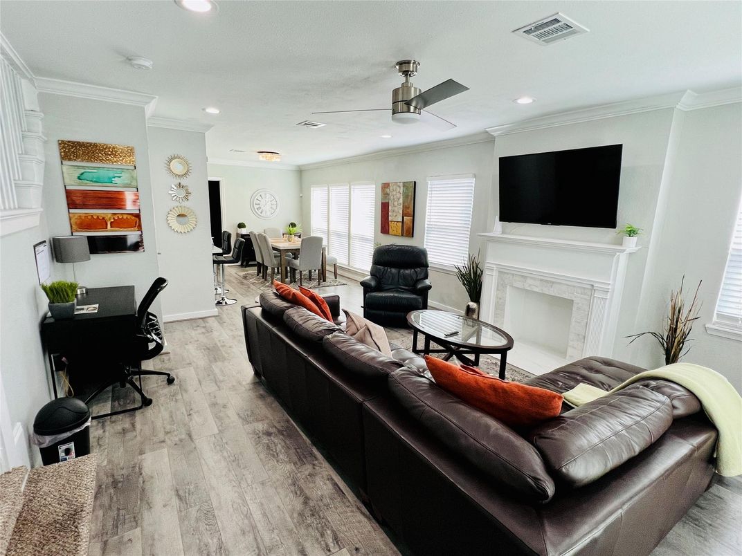 Dining room, Fireplace, Interior, Living room, Recessed Lighting, Wood Texture Flooring