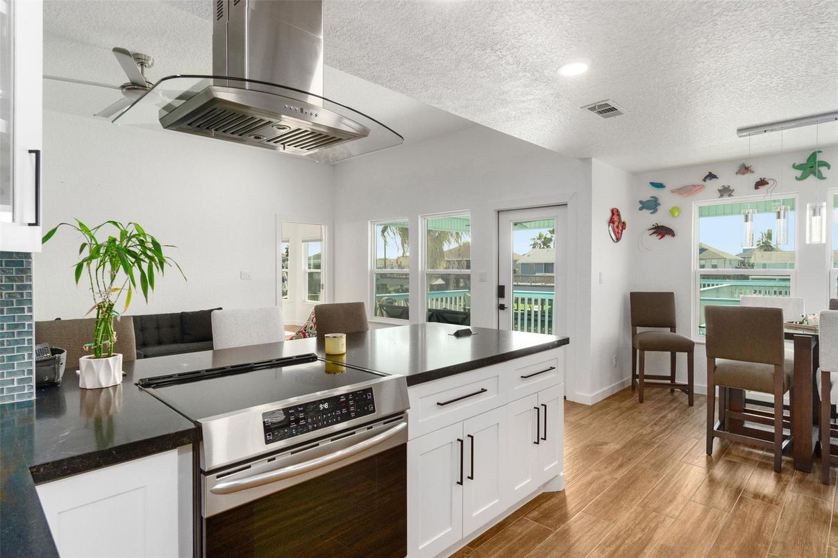 Dining room, Interior, Kitchen, Recessed Lighting, Stainless Steel Appliances, Wood Texture Flooring