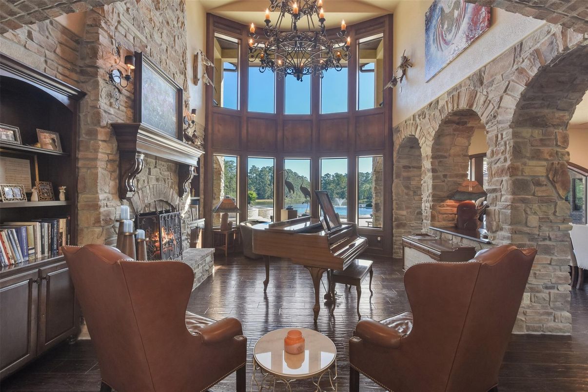 Chandelier, Fireplace, Interior, Piano, Stone Walls, Wood Texture Flooring