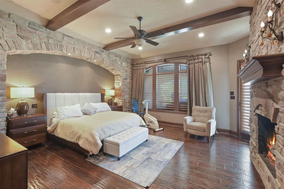 Bedroom, Fireplace, Interior, Recessed Lighting, Stone Walls, Wooden Beams, Wood Texture Flooring