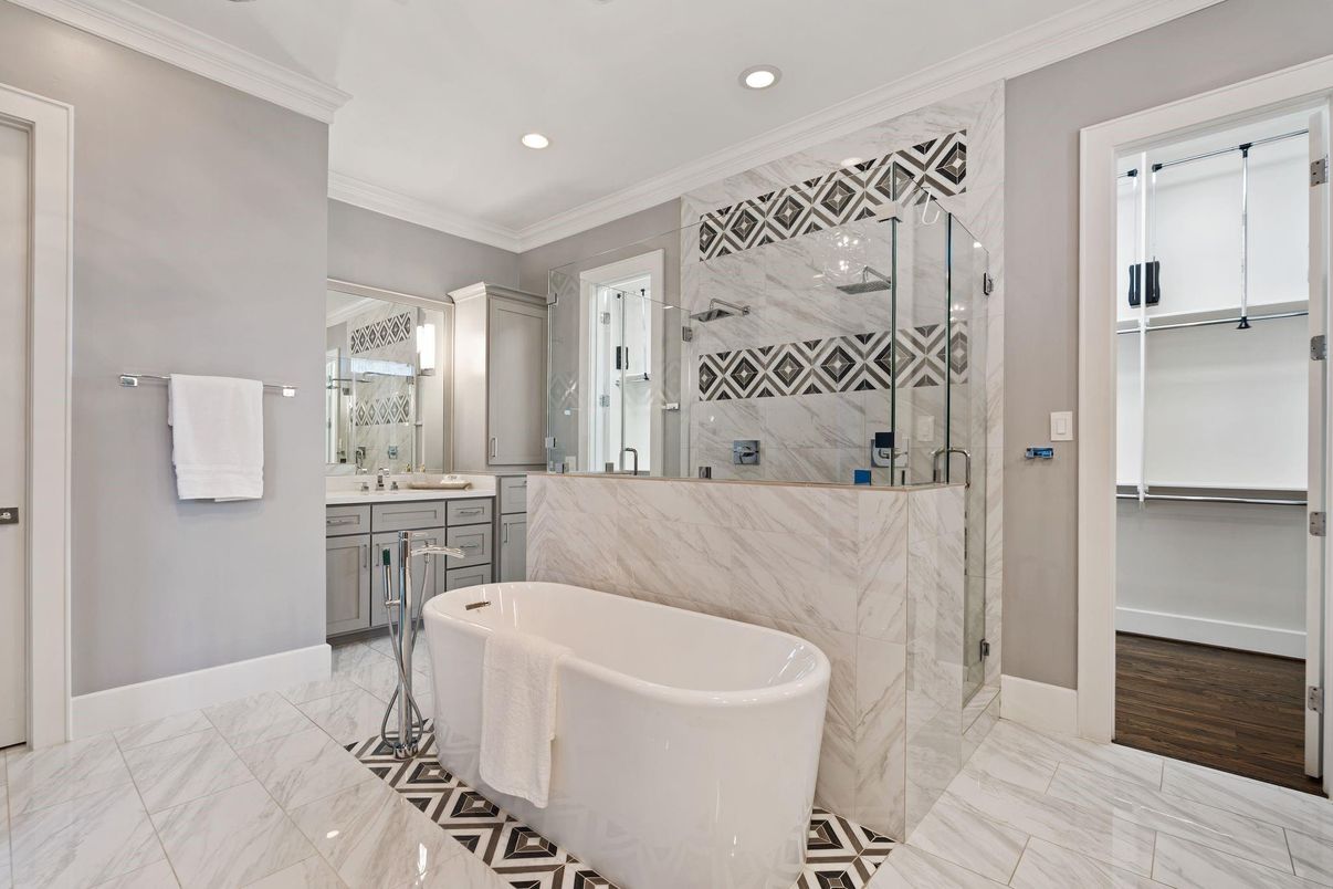 Bathroom, Free Standing Baths, Glass Shower, Interior, Marble, Marble Walls, Recessed Lighting, Wood Texture Flooring
