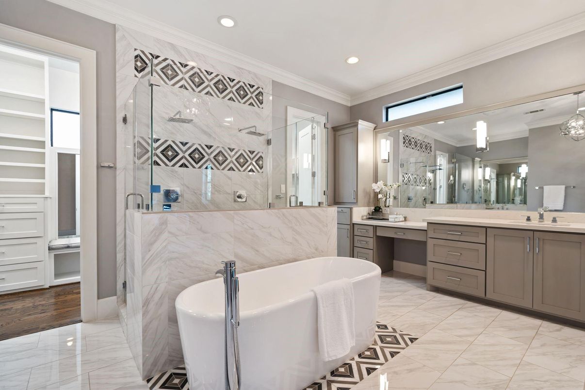 Bathroom, Dual Sink Vanities, Free Standing Baths, Glass Shower, Interior, Marble, Marble Walls, Recessed Lighting, Wood Texture Flooring