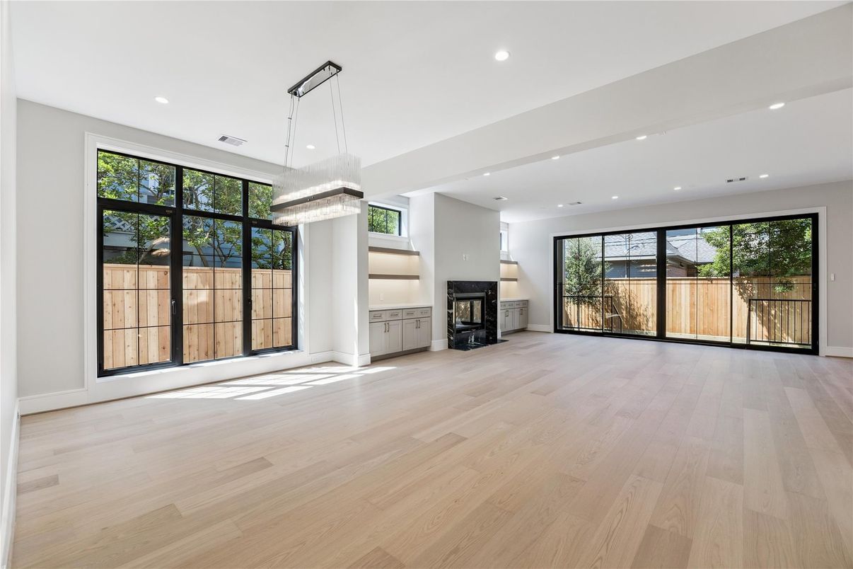 Chandelier, Empty room, Fireplace, Interior, Recessed Lighting, Wood Texture Flooring