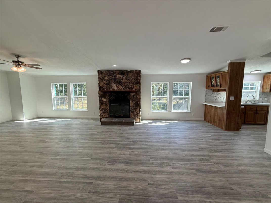 Empty room, Fireplace, Interior, Kitchen, Recessed Lighting, Wood Texture Flooring