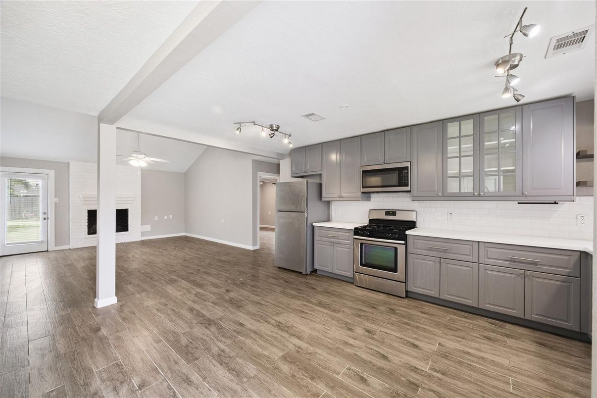 Empty room, Interior, Kitchen, Stainless Steel Appliances, Wood Texture Flooring