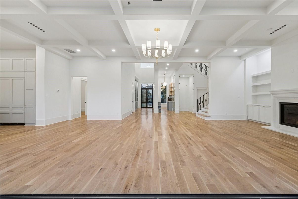 Chandelier, Empty room, Fireplace, Interior, Recessed Lighting, Wood Texture Flooring