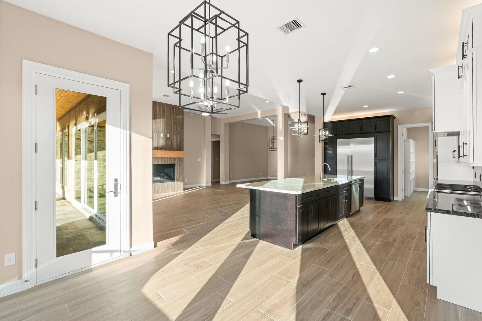 Fireplace, Interior, Kitchen, Pendant Lights, Recessed Lighting, Stainless Steel Appliances, Wood Texture Flooring