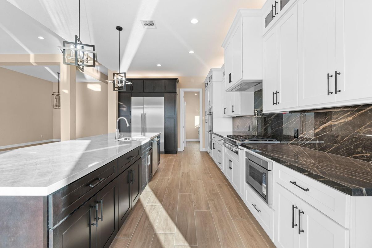 Interior, Kitchen, Marble Walls, Pendant Lights, Recessed Lighting, Stainless Steel Appliances, Wood Texture Flooring