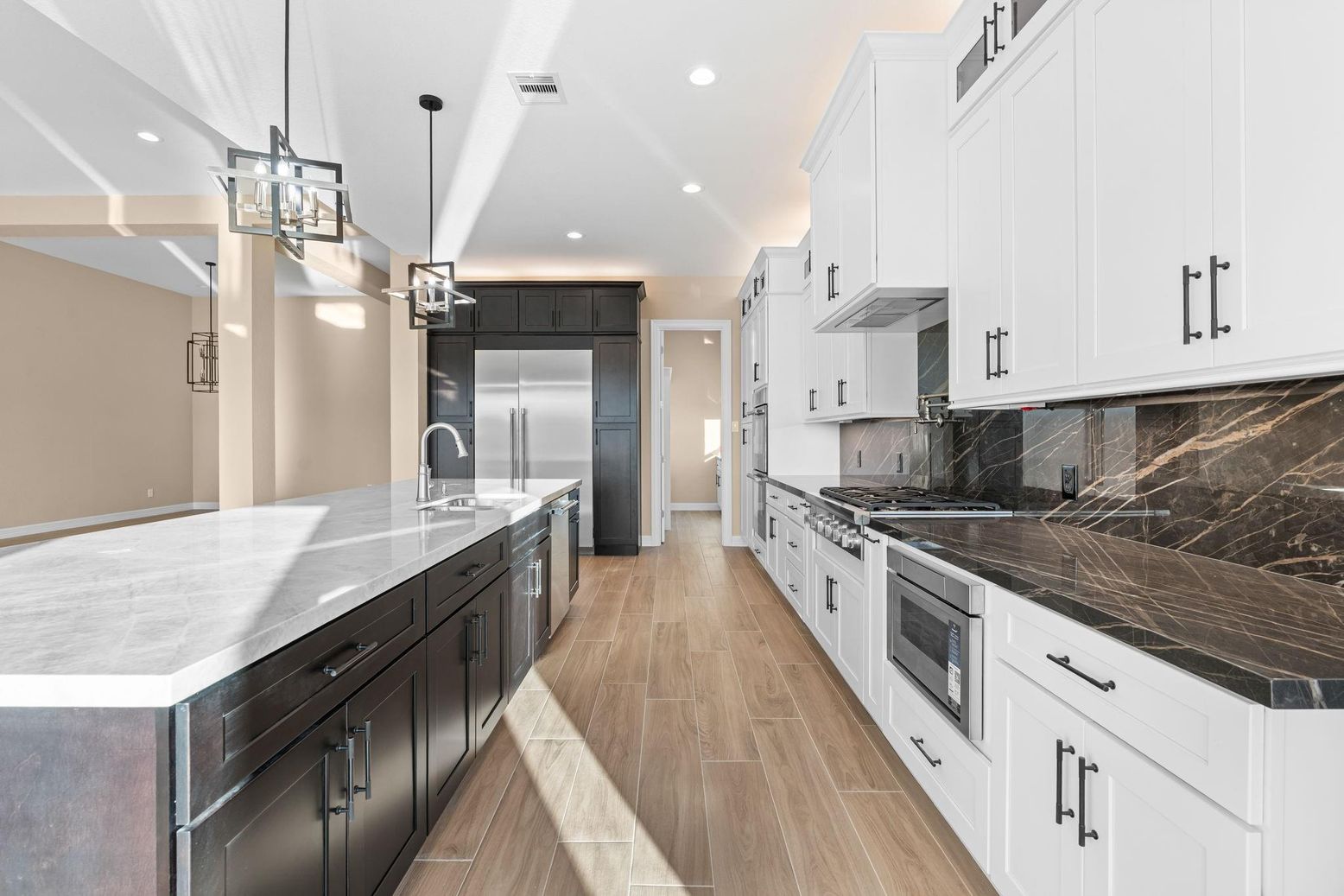 Interior, Kitchen, Marble Walls, Pendant Lights, Recessed Lighting, Stainless Steel Appliances, Wood Texture Flooring
