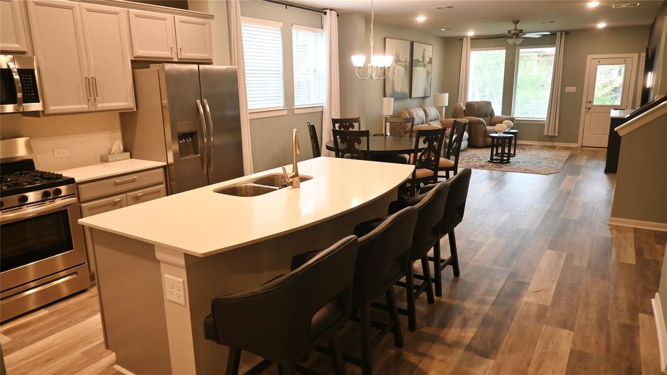 Dining room, Interior, Kitchen, Living room, Pendant Lights, Recessed Lighting, Stainless Steel Appliances, Wood Texture Flooring