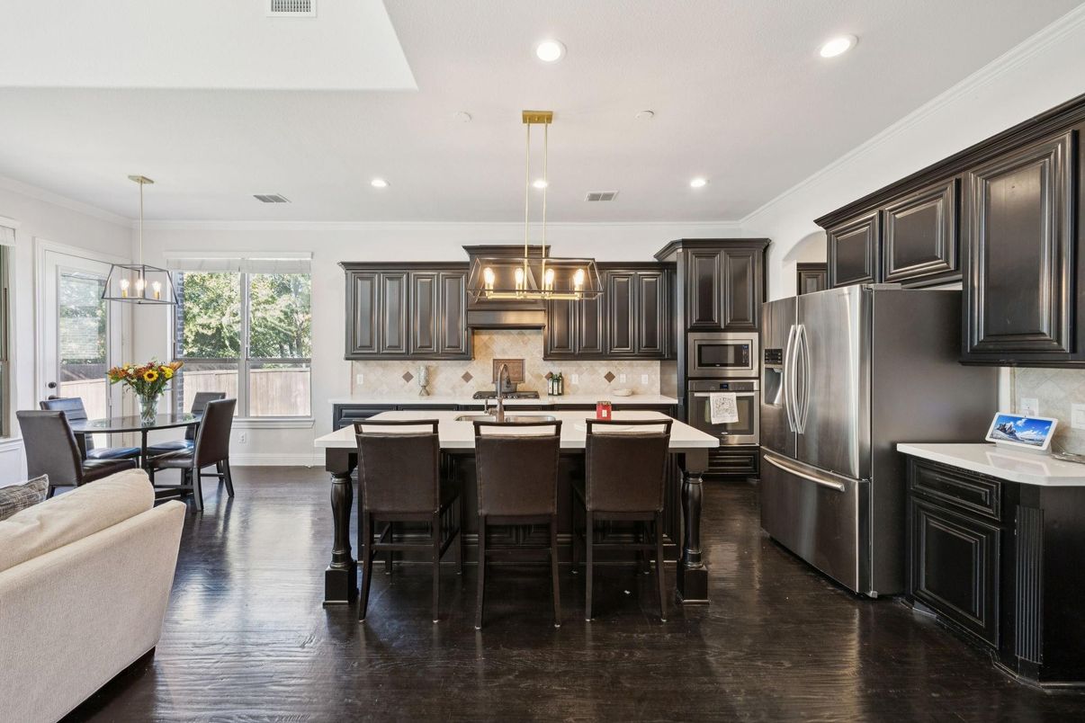 Dining room, Interior, Kitchen, Pendant Lights, Recessed Lighting, Stainless Steel Appliances, Wood Texture Flooring