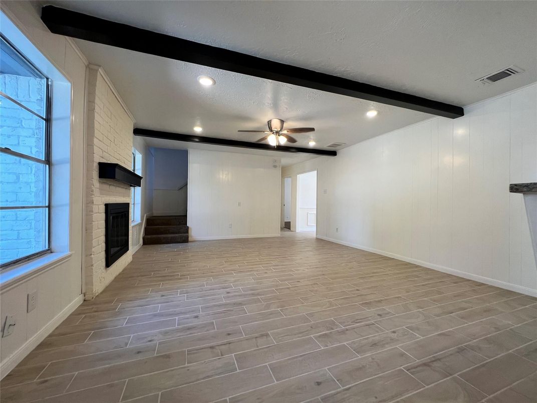 Empty room, Fireplace, Interior, Recessed Lighting, Wooden Beams, Wood Texture Flooring